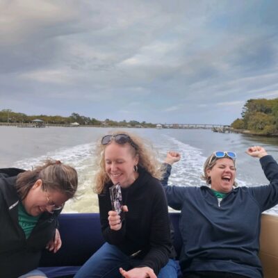 Friends laughing on a luxury yacht charter in Charleston SC