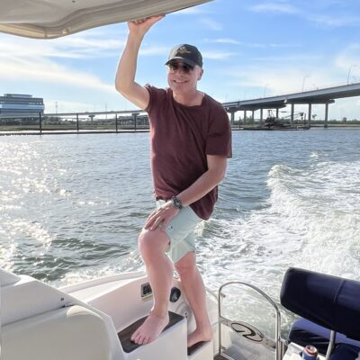 man riding a boat charter in charleston sc