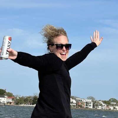woman enjoying a drink on a luxury yacht charter in Charleston SC