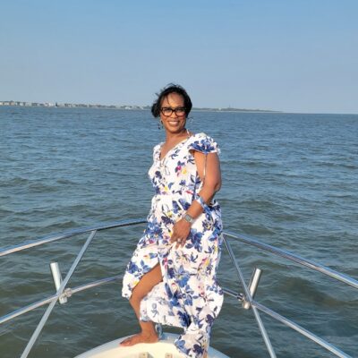 Woman enjoying Charleston harbor on boat rental